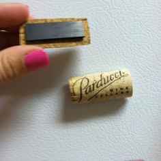 Cut wine corks in half, hot glue to magnet and now you have cute cork magnets